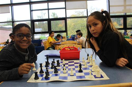 Boy and Girl play chess