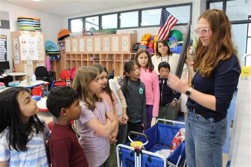 Woman talks to students