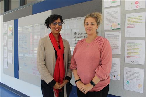 Two women in school hallway