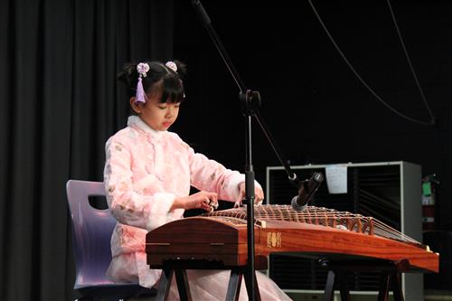 Girl playing Chinese harb