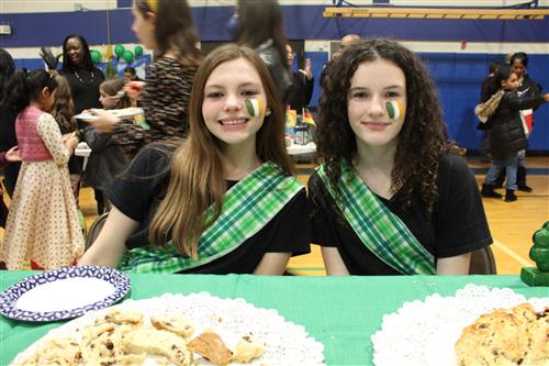 Two girls with plaid sashes