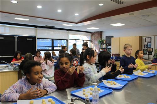 Group of students making cookies