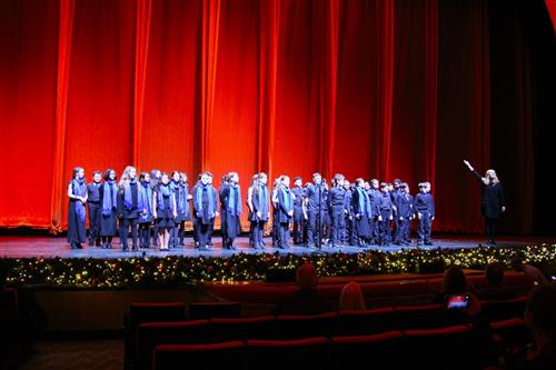 Group sings on stage