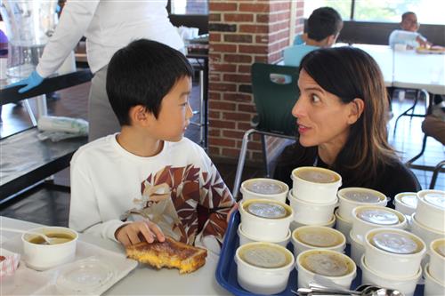 Boy talking to woman