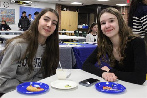 Two girls enjoy some food